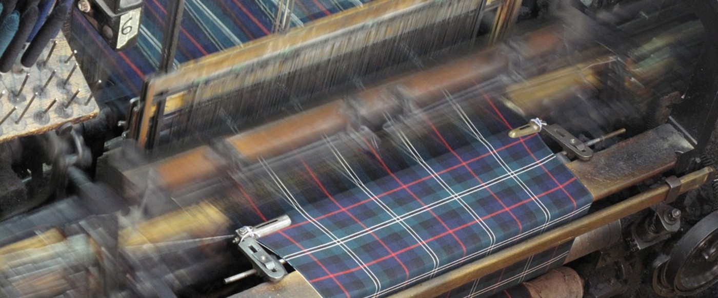 Weaving fabrics by various systems.