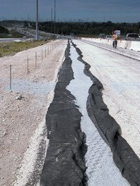 This nonwoven geotextile is used in a drainage application during roadway construction. This nonwoven geotextile is used in a drainage application during roadway construction.